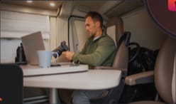 Photographer retouching in a camper van